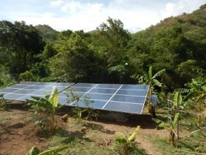A solar array catches sunlight in rural Colombia
