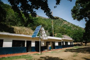 Solar panels outside of a community building in Katansama deliver sustainable power