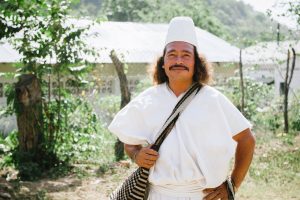 An Arhuaco man smiles at the camera