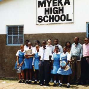 People stand in front of Myeka High School in South Africa