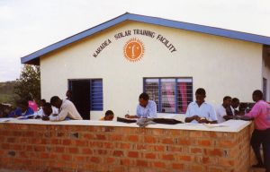 Students study outside the Karadea Solar Training Facility in Tanzania