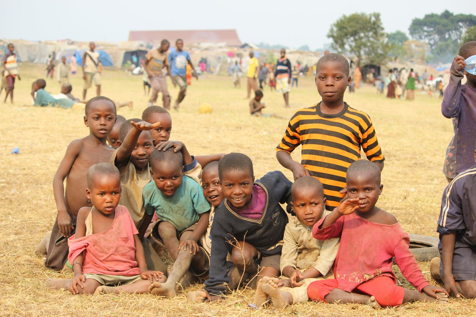 Children gather for a photo in a community where donations support solar panels