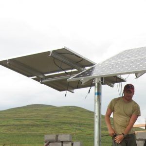 People set up a solar array in Lesotho