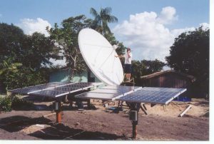A man works to set up a solar-powered satellite in the Amazon Rainforest in Brazil