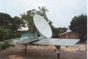 A solar array and a satellite provide power and connectivity to a rural community in Brazil