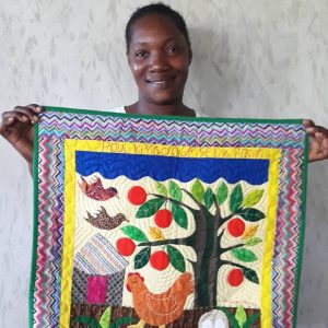 Haitian with hand-stitched quilt