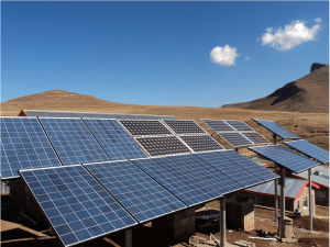 A solar array sits against an arid landscape