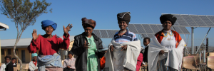 Community members in the Eastern Cape stand in front of a local school's new solar array