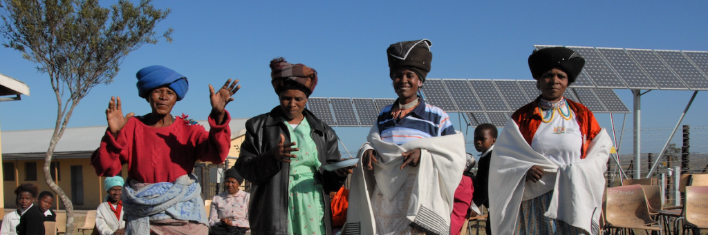 Community members in the Eastern Cape Province of South Africa celebrate new solar panels from the Solar Electric Light Fund (SELF), which will help combat climate and poverty