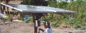 Solar technician installs a panel in the Amazon Rainforest