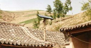 Solar panel sits on top of a home in Gansu Province, China