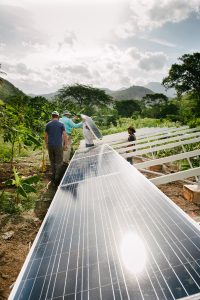 People set up solar panels for Arhuaco Indigenous community in Colombia